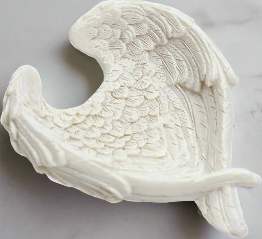 The Angel Wing Bowl stands as a testament to the seamless fusion of artistic finesse and practicality. Crafted with attention to detail from high-quality resin, this bowl showcases a level of craftsmanship that is both awe-inspiring and enduring. Every delicate contour of the angel wings, every intricately etched feather, reflects a dedication to quality that is evident from the first glance. candle holder crystal dish