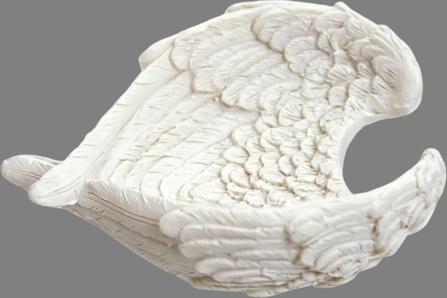 The Angel Wing Bowl stands as a testament to the seamless fusion of artistic finesse and practicality. Crafted with attention to detail from high-quality resin, this bowl showcases a level of craftsmanship that is both awe-inspiring and enduring. Every delicate contour of the angel wings, every intricately etched feather, reflects a dedication to quality that is evident from the first glance. candle holder crystal dish 