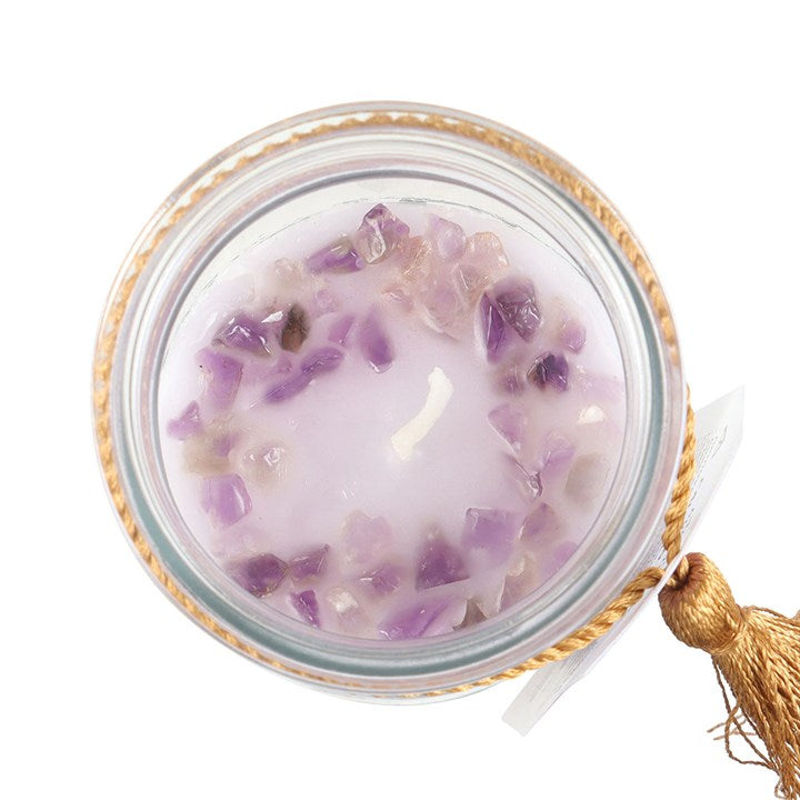 Inspired by traditional 7-day prayer candles, this tube candle comes in a beautiful blackberry fragrance. Accented with gold ‘Turn your dreams into a reality' text and amethyst crystal chips, this candle promotes calm and relaxation. Crystals will release from wax with use and can be reused for a multitude of spiritual purposes. Paraffin wax. Approximately 50 hours of burn time.

