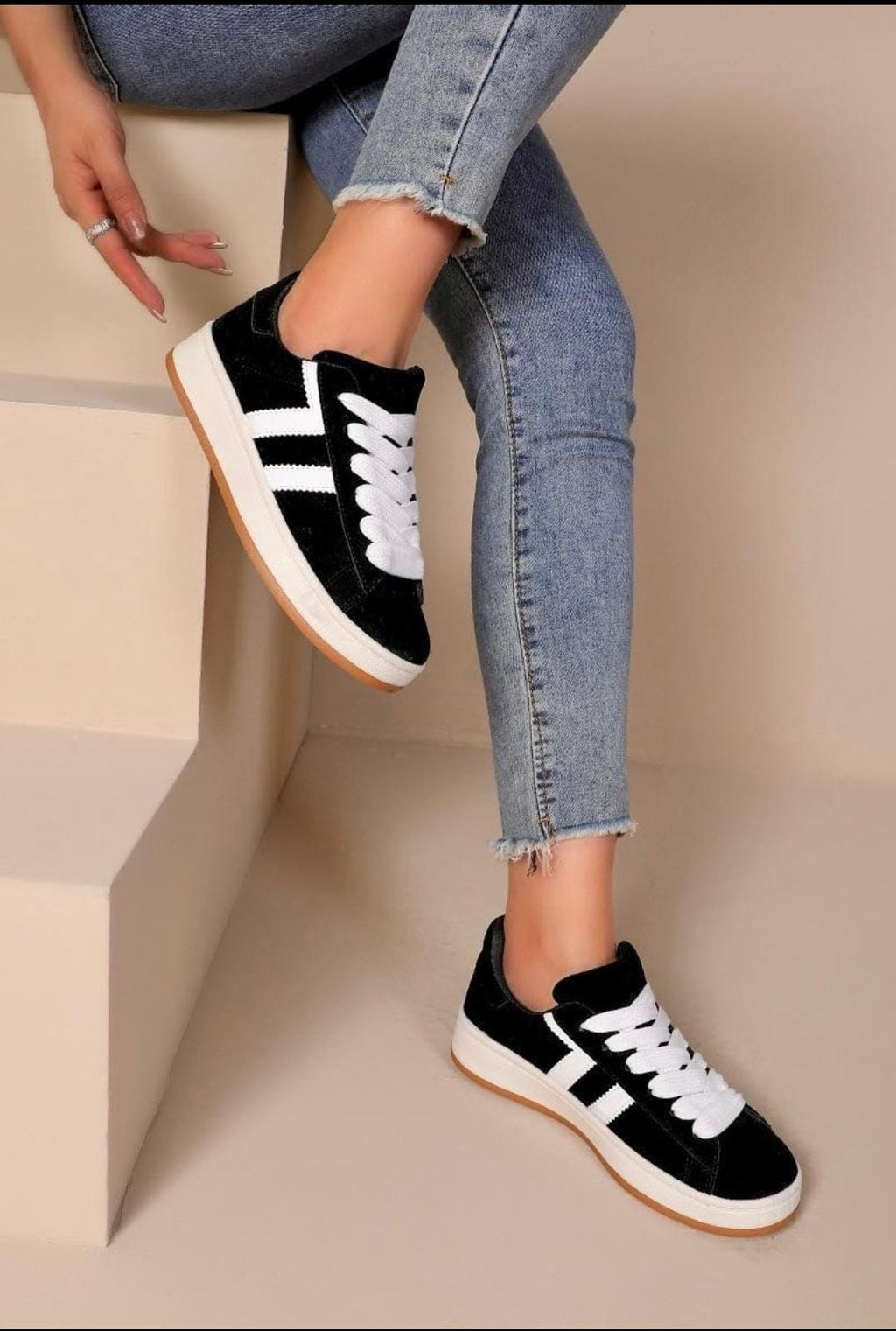 Eve is a chunky sole skater style trainer, available in Grey or black with 2 white stripes on the side &amp; a gum plated sole for the retro look.