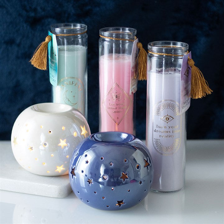 Inspired by traditional 7-day prayer candles, this tube candle comes in a beautiful mystical rose fragrance. Accented with gold ‘Let your inner light shine' text and rose quartz crystal chips, this candle promotes self-love and confidence. Crystals will release from wax with use and can be reused for a multitude of spiritual purposes. Paraffin wax. Approximately 50 hours of burn time.

